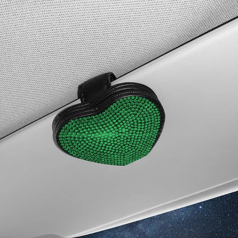 Diamond decorated PU leather magnetic clip for car sun visor holding sunglasses.