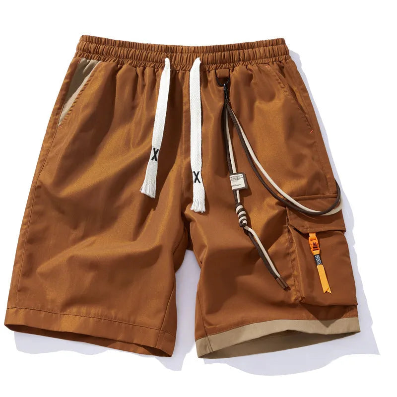 Man wearing coffee-coloured loose-fit bamboo fibre plus size sports shorts with a high waist.