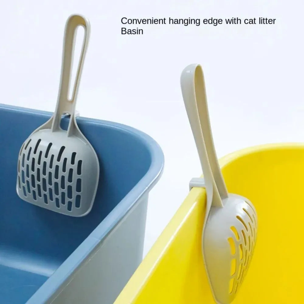 Grey plastic cat litter scoop with a built-in waste-catching base on a white background.