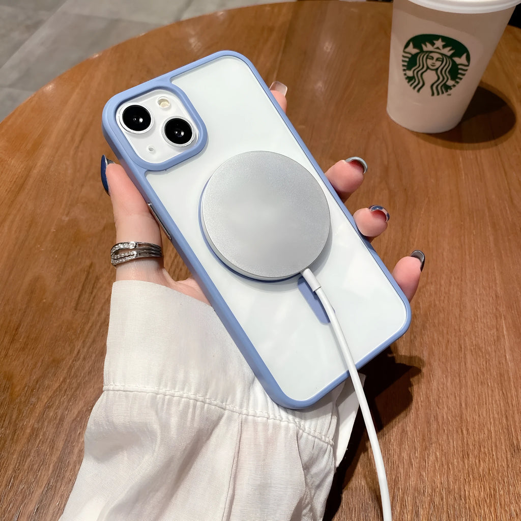 Transparent acrylic MagSafe phone case for iPhone on a table, showing magnetic ring and clear back.
