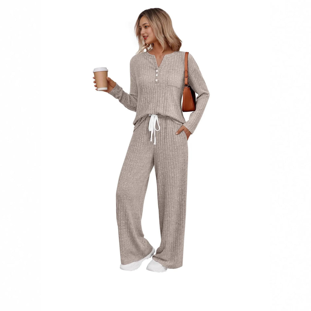 Women's striped knitted long coat with V-neck, long sleeves, lace-up detail, and side pockets.