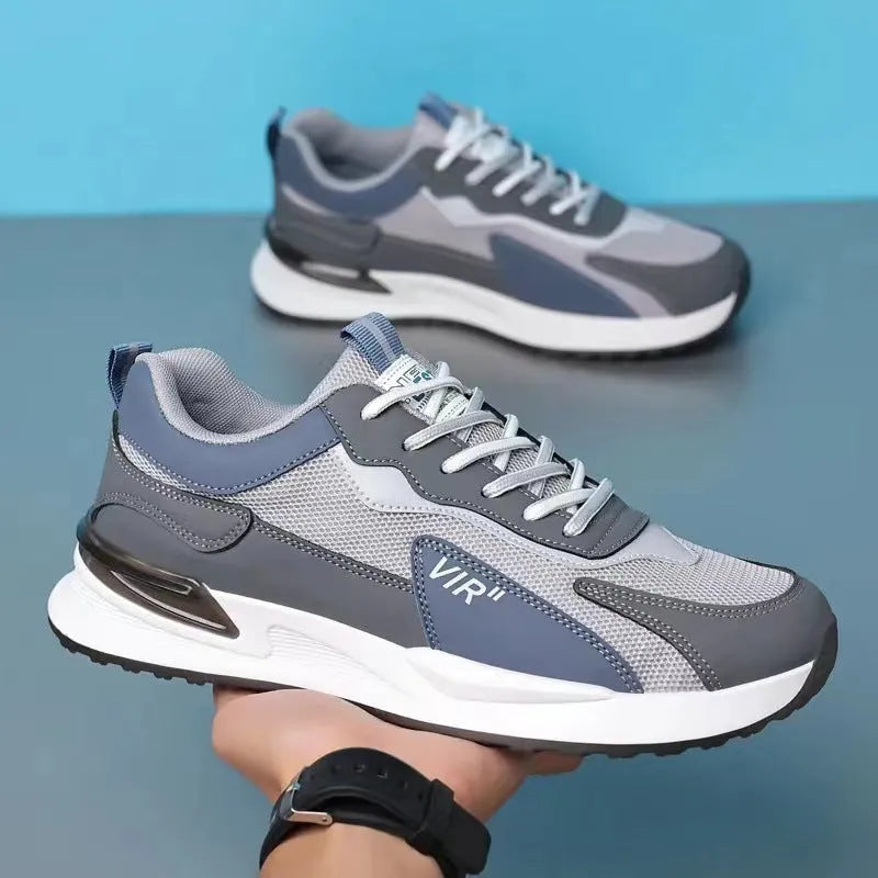 Men's low-top lace-up sneakers with colour block mesh upper and injection moulded sole.