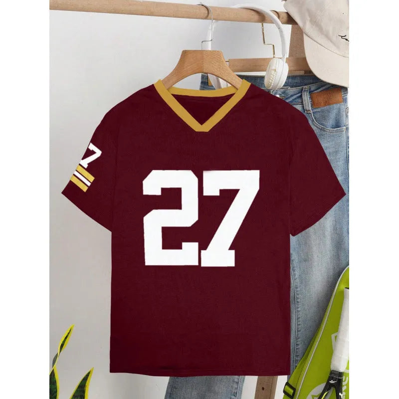 Man's loose fit red cotton t-shirt with a digital print of contrasting green letters on the front.