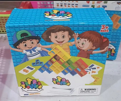 Plastic balance stacking game with 16 coloured building blocks on chassis