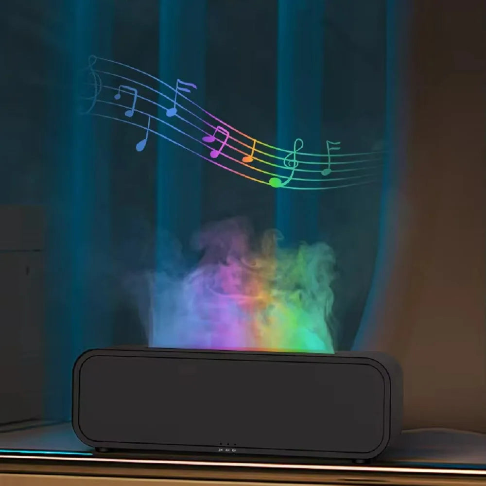 Black and white aroma diffuser with flame animation and coloured LED lights on a wooden table.