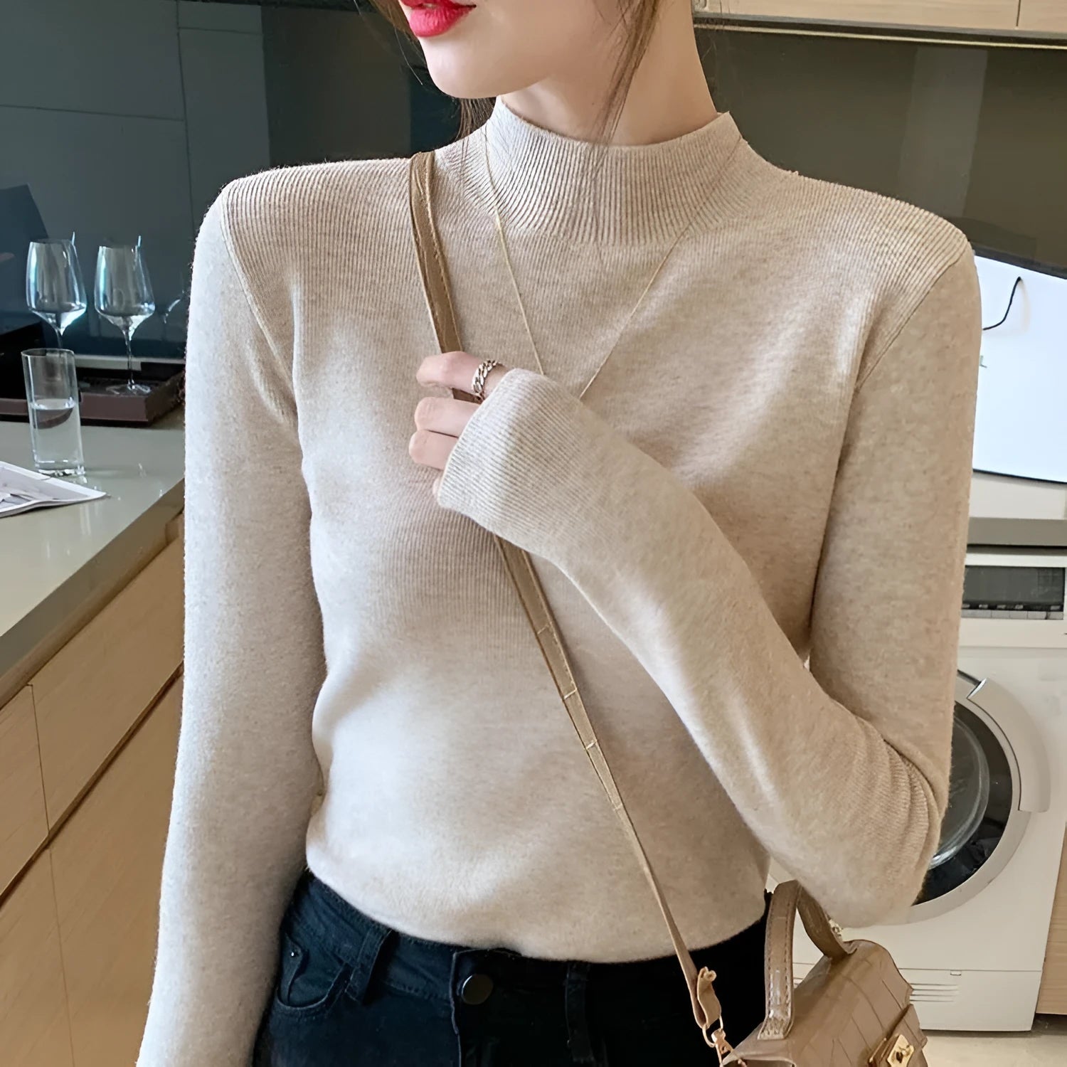 Women's slim fit long sleeve knitted pullover top in viscose fibre, shown in apricot colour.