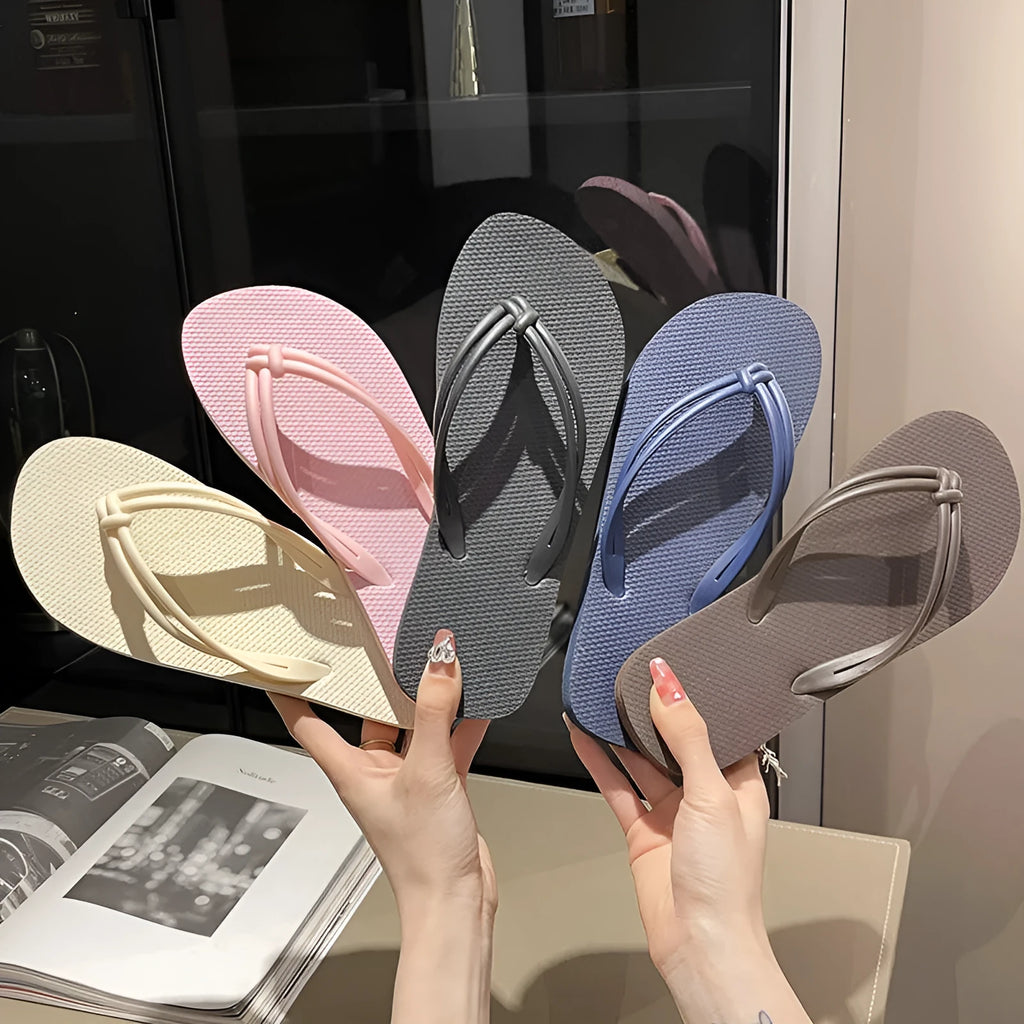Men's casual flip flops with toe covering in PVC material, showing non-slip sole pattern and full foot enclosure design