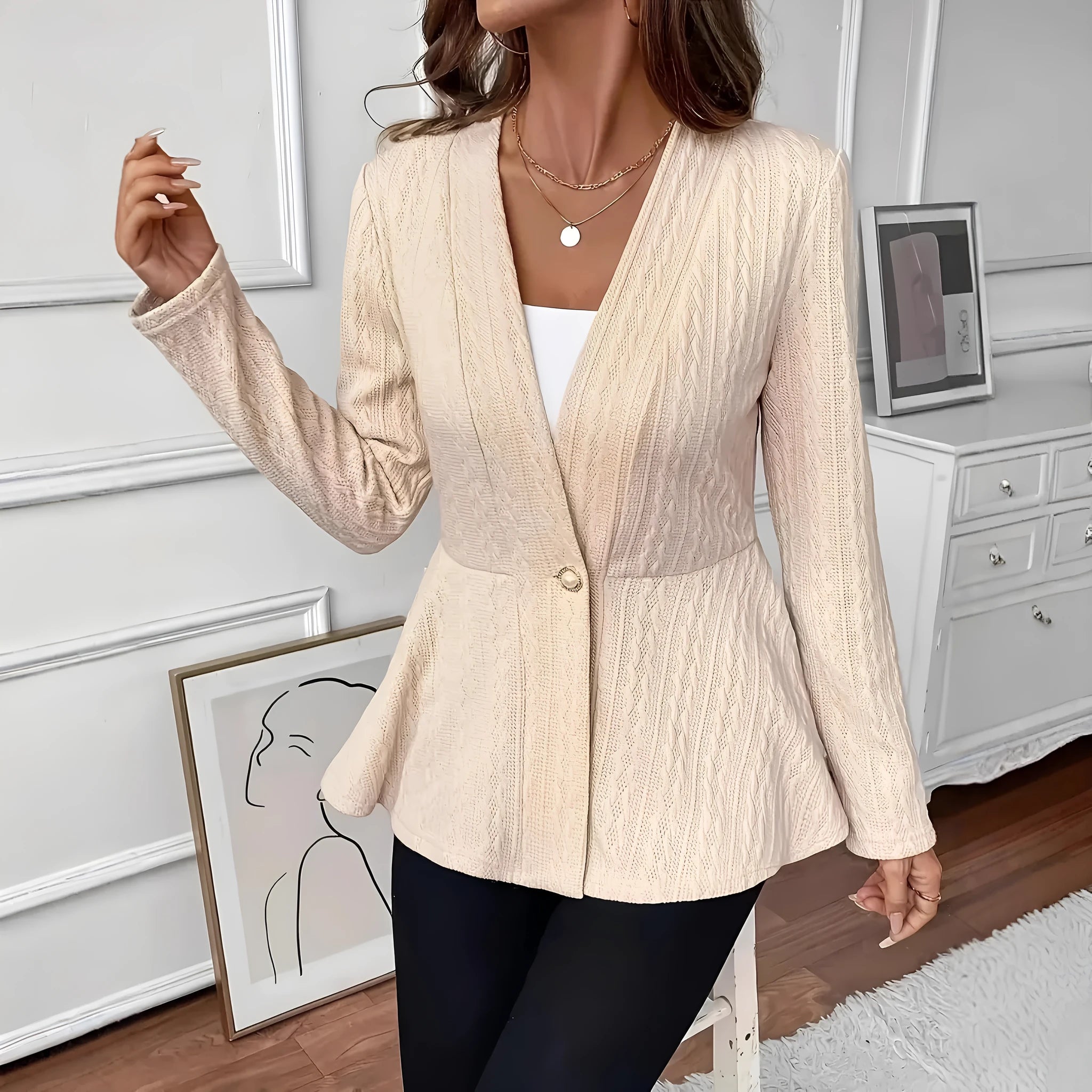 Women's apricot knitted cardigan with one button and jacquard texture on hanger