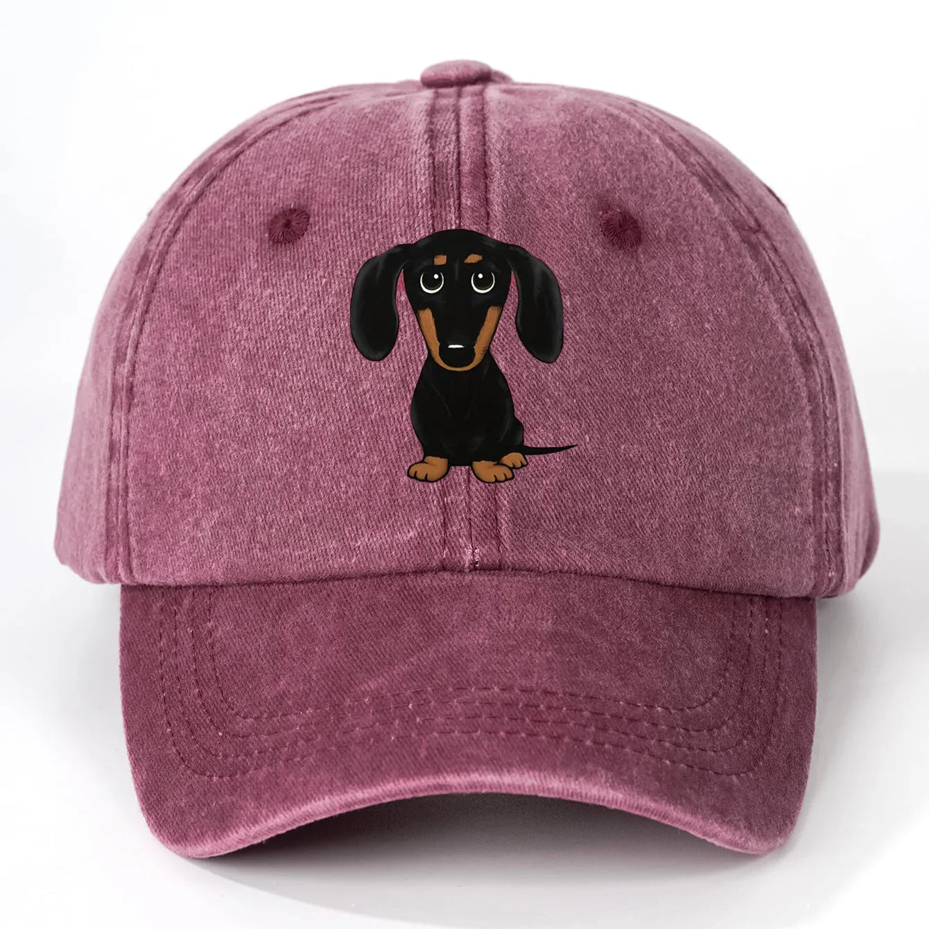 Retro washed blue cotton baseball cap with an embroidered brown dachshund design on the front.