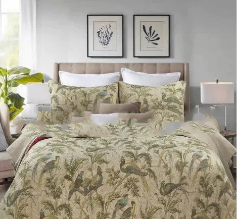 Blue cotton bedspread with floral and bird pattern, part of a 3-piece quilted bedding set.