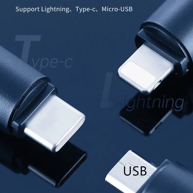 Black capsule-shaped infrared emitter with Lightning, Type-C and Micro-USB interfaces, shown next to a ruler for scale.