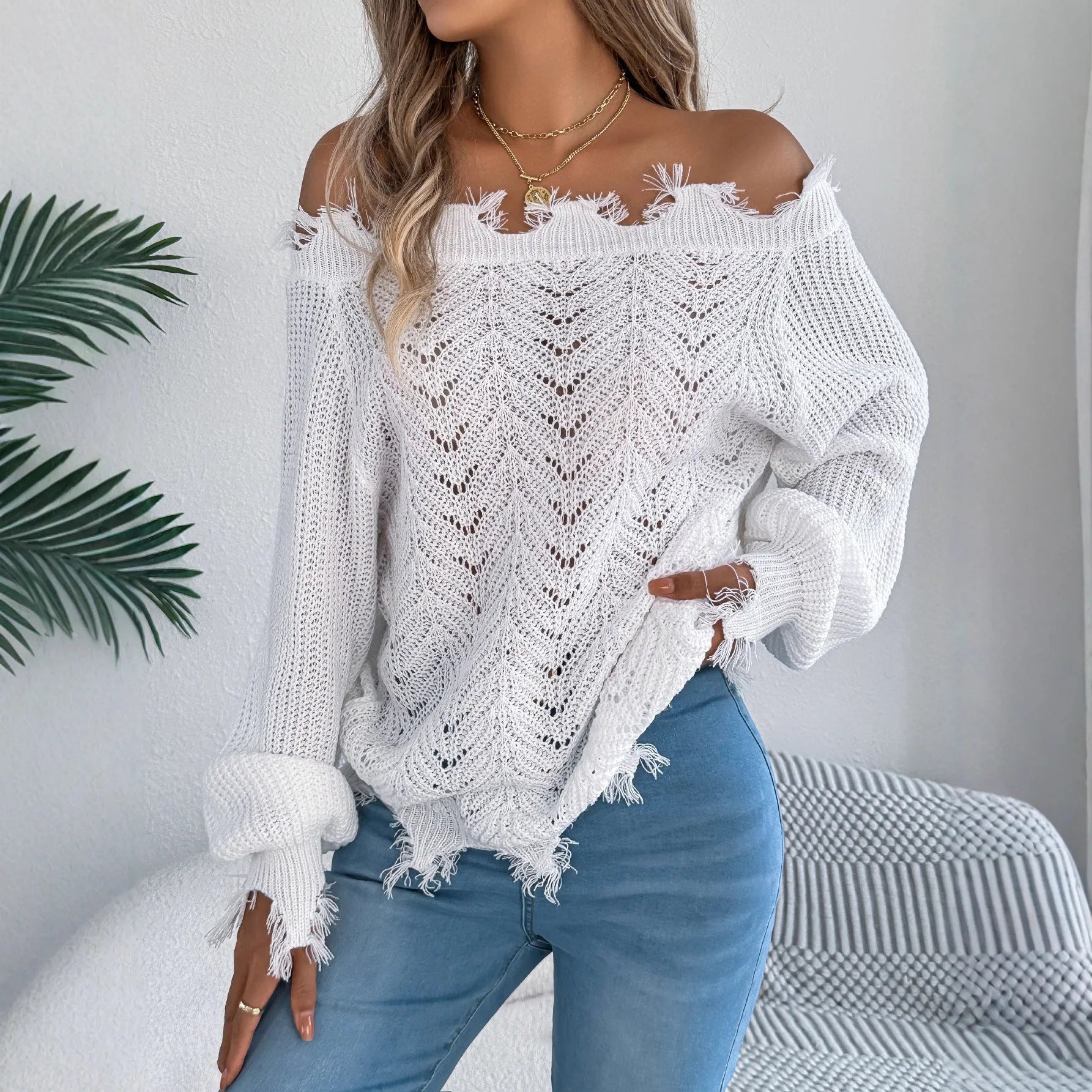 Women's white cut off-the-shoulder pullover sweater with hollow-out design and long sleeves
