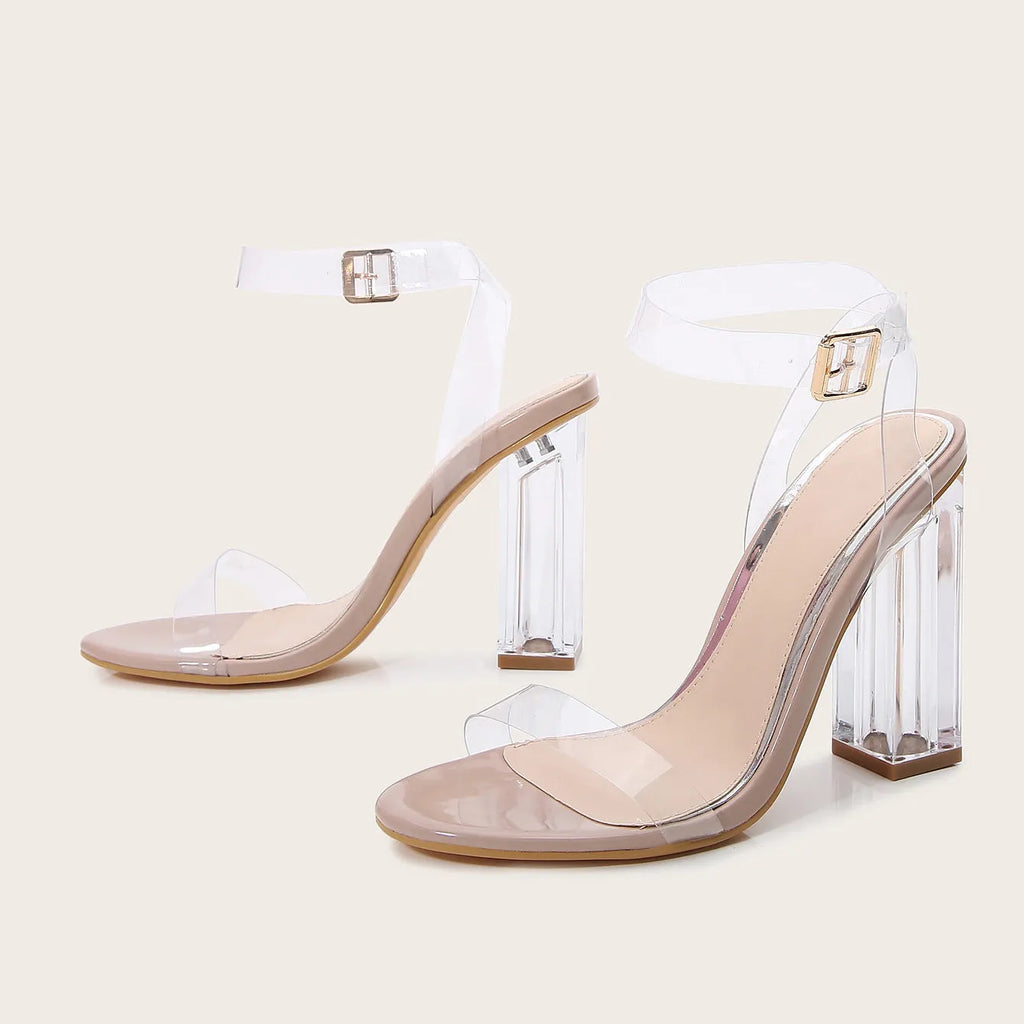 Apricot-coloured women's high heel sandals with clear glass heels and an ankle buckle strap.