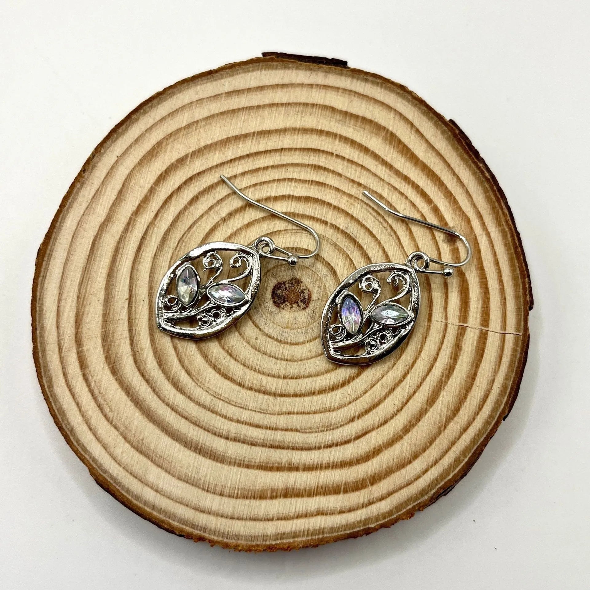 Silver leaf-shaped earrings with embedded colourful moonstones on alloy stud backs
