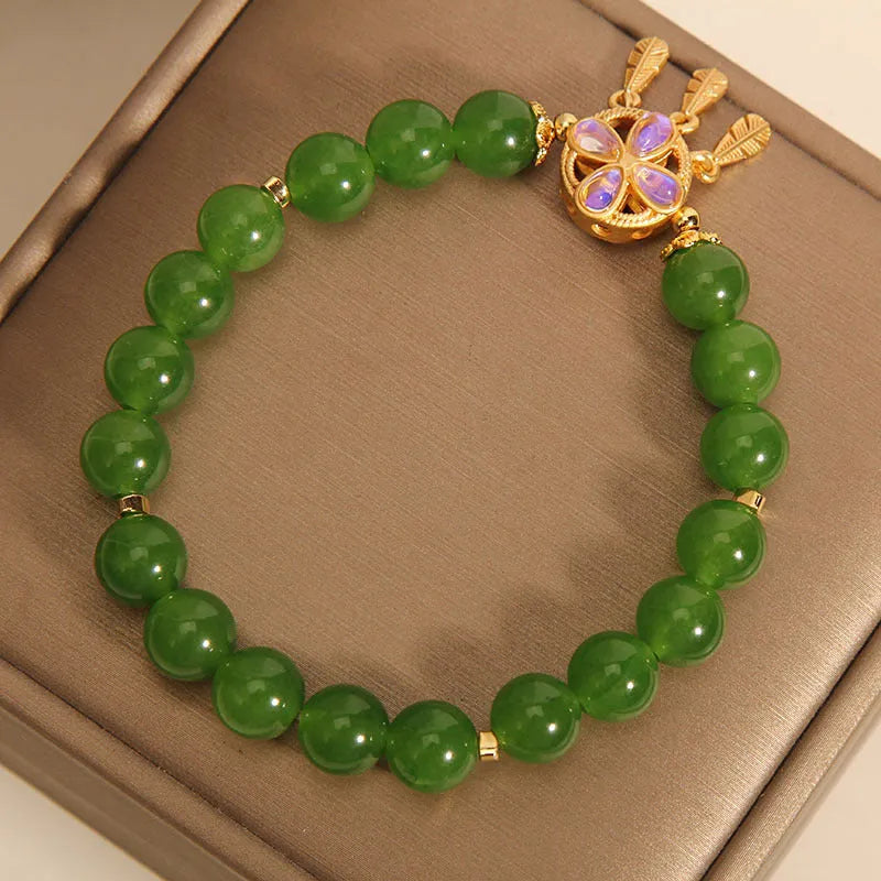 Green jasper crystal bracelet for women with four-leaf clover dream catcher pendant.