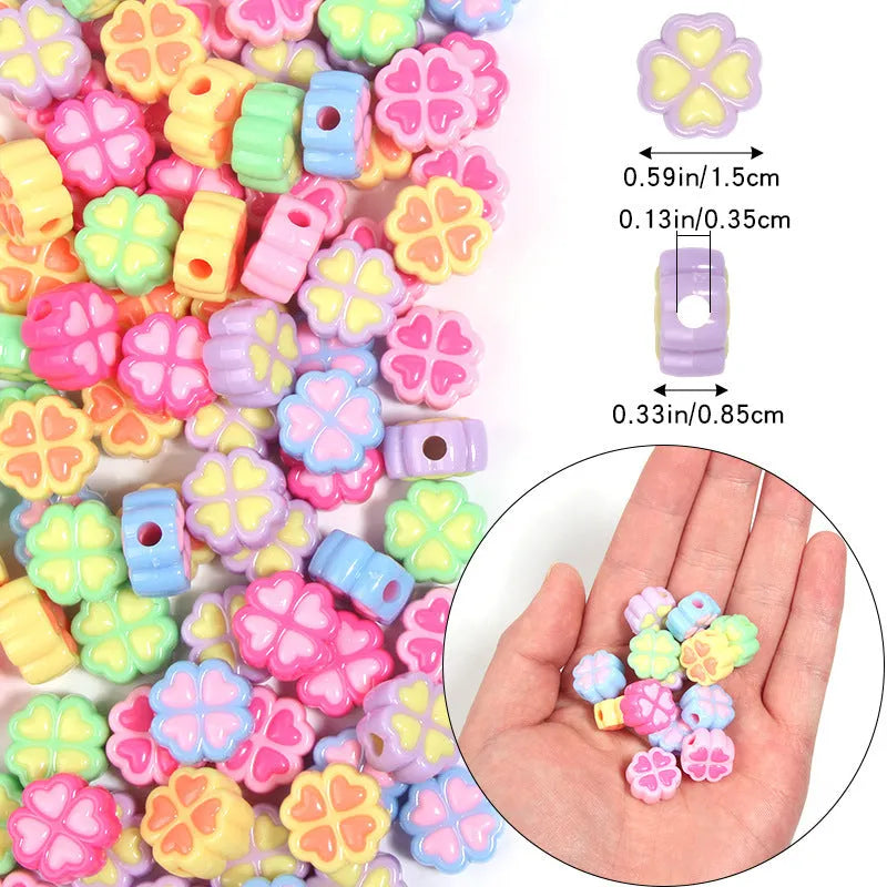 Assorted light-coloured acrylic clover-shaped beads with frosted finish, 15mm size.