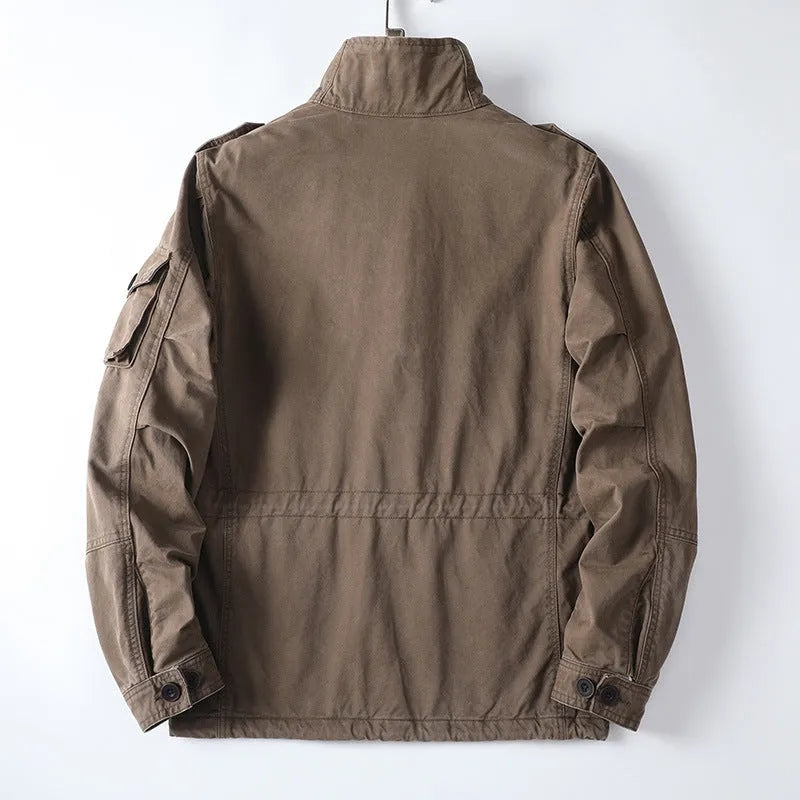 Men's loose fit cotton zip-up jacket in light brown shown on a model.