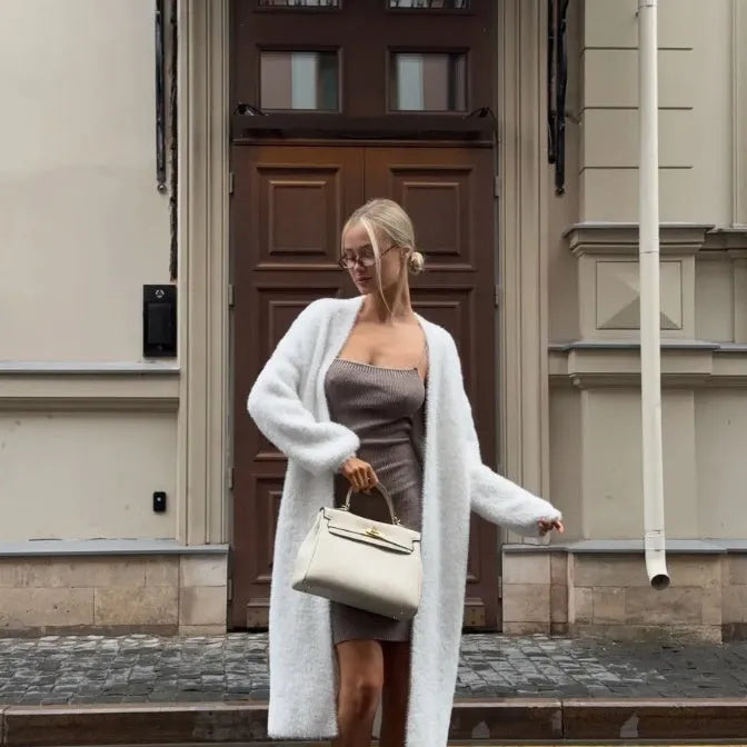 White polyester knit cardigan jacket with extended length and loose fit