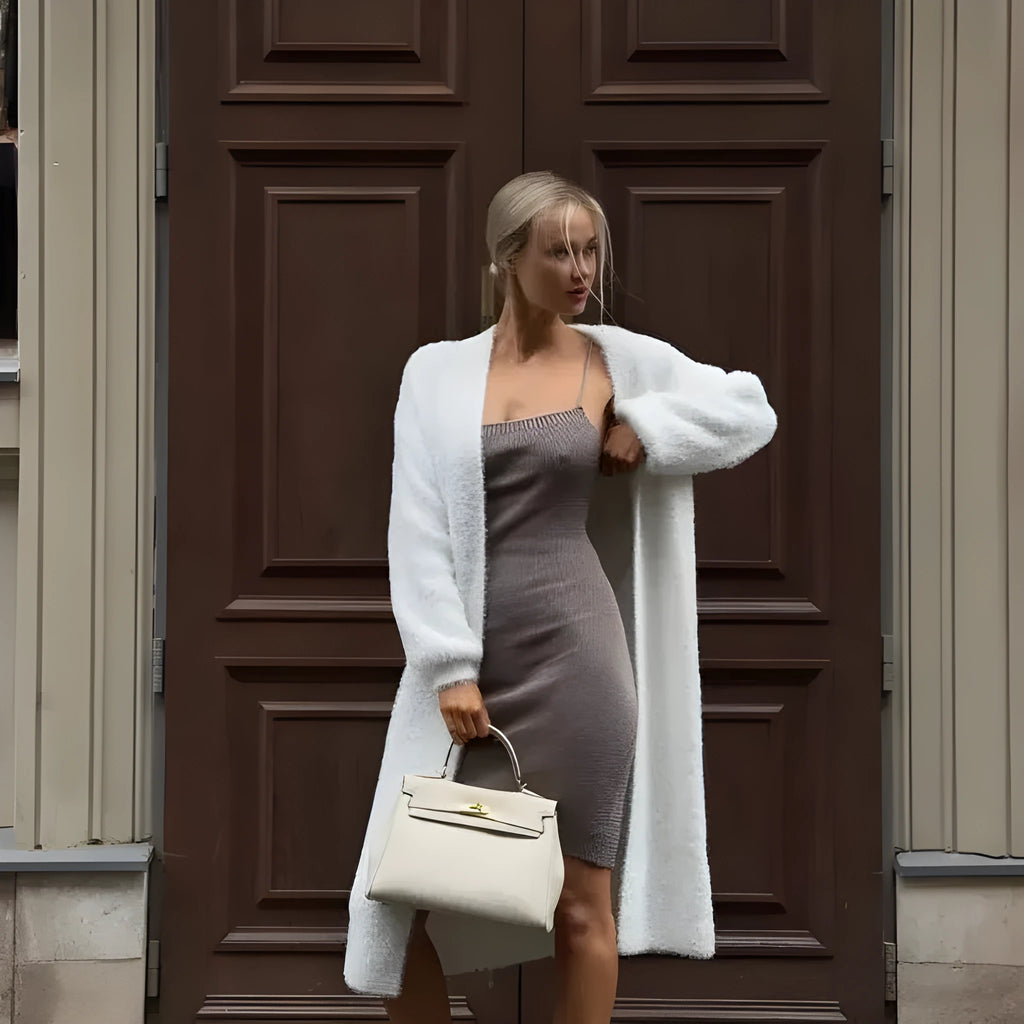 White polyester knit cardigan jacket with extended length and loose fit