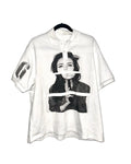 Short sleeved polyester polo shirt with a printed pattern, shown in a straight cut and medium length.