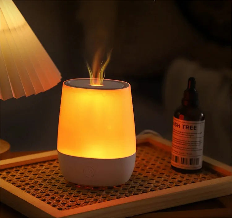 White USB aroma diffuser with simulated flame effect showing mist output
