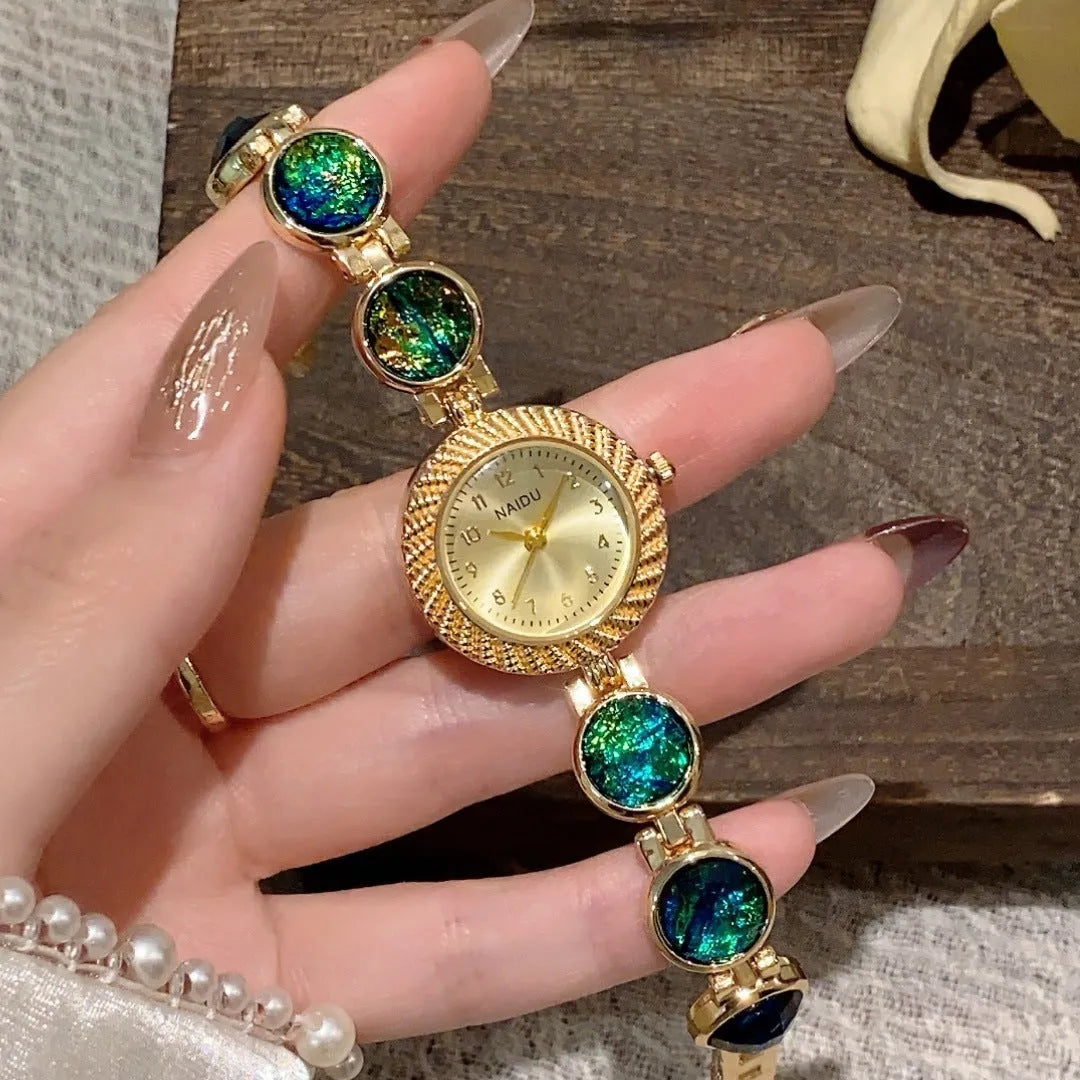 Women's quartz watch with 25mm round dial in zinc alloy case showing spiral crown and colour options