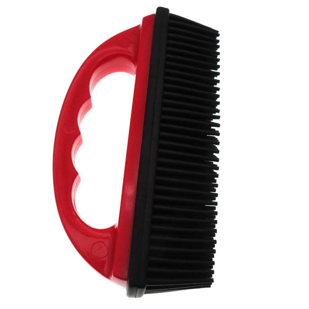Red handheld pet hair removal brush with rubber bristles for grooming dogs and cleaning carpets.