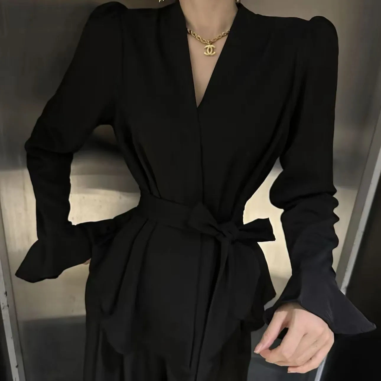 Women's French-style black shirt with irregular collar and long bell sleeves