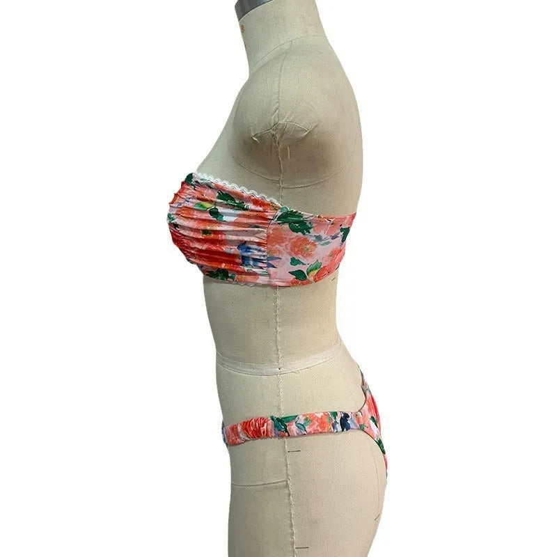 Women's floral print bikini set with lace trim on tube top and briefs in blue colour