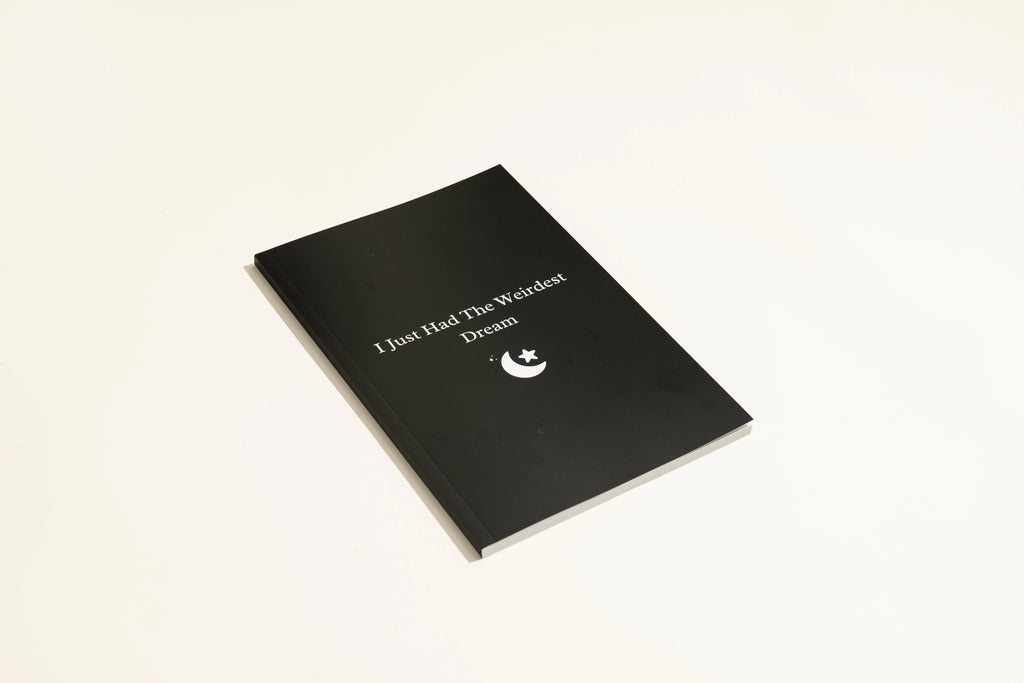 Black leather A5 dream journal notebook with embossed cover and lined pages