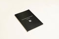 Black leather A5 dream journal notebook with embossed cover and lined pages