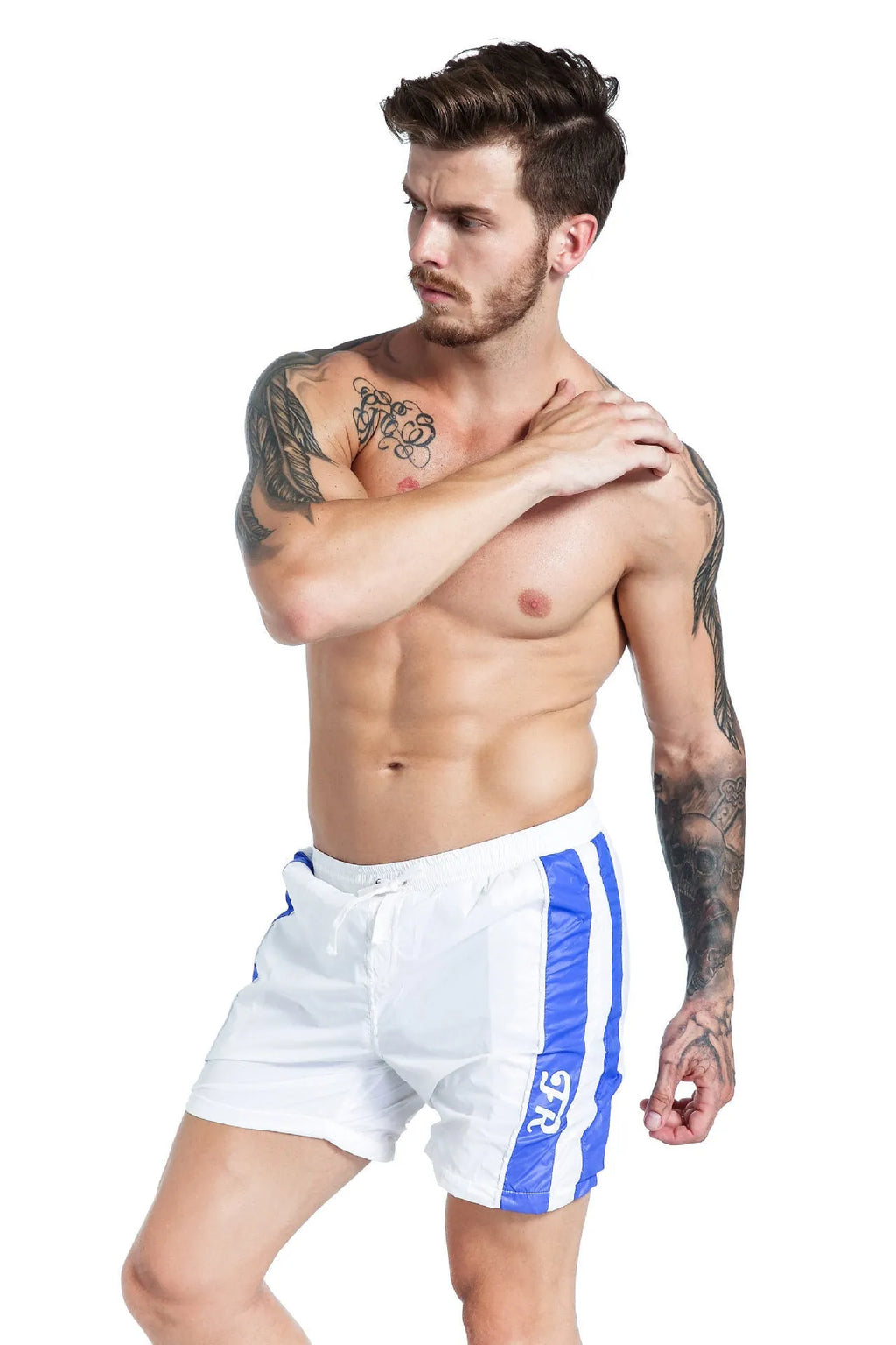 Men's blue polyester sports shorts with lace-up front and slim fit, shown on a hanger.