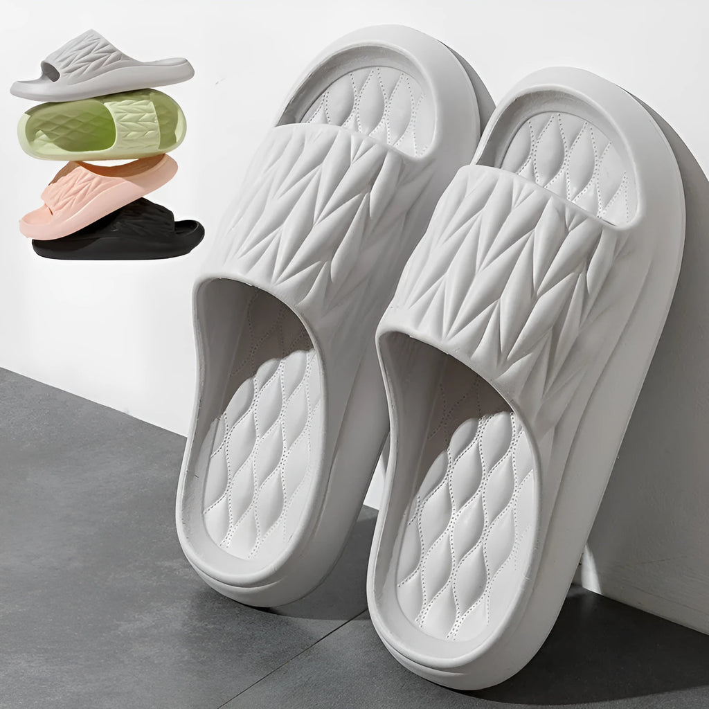 Leaf texture design EVA household slippers in multiple colours on a white background.