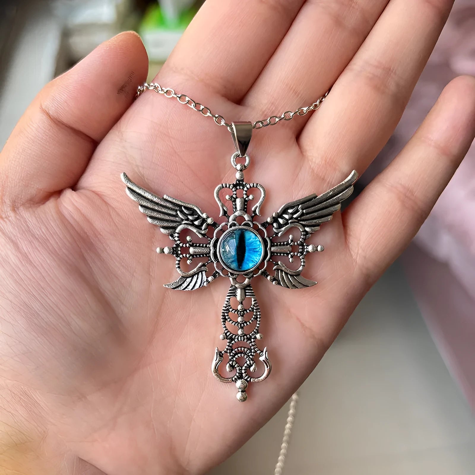 Alloy devil wings cross pendant necklace showing geometric design in available colour options