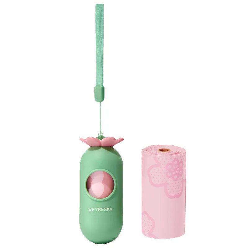 Dog poo bag dispenser capsule with strawberry pattern and roll of 15 biodegradable scented bags