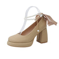 Women's beige Mary Jane shoes with a chunky heel and silver ankle-strap buckle on a round toe PU upper.