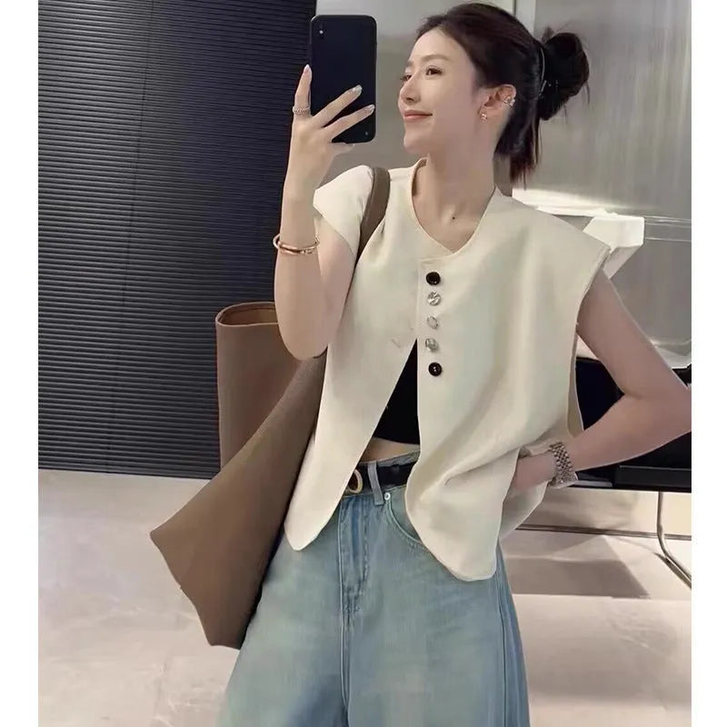 Women's loose fit polyester vest in milky white colour with front pocket