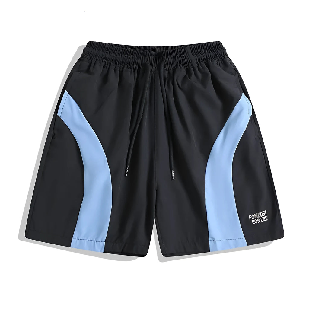 Man wearing black loose-fitting quick-dry training shorts with an elastic waist, suitable for sports and casual wear.