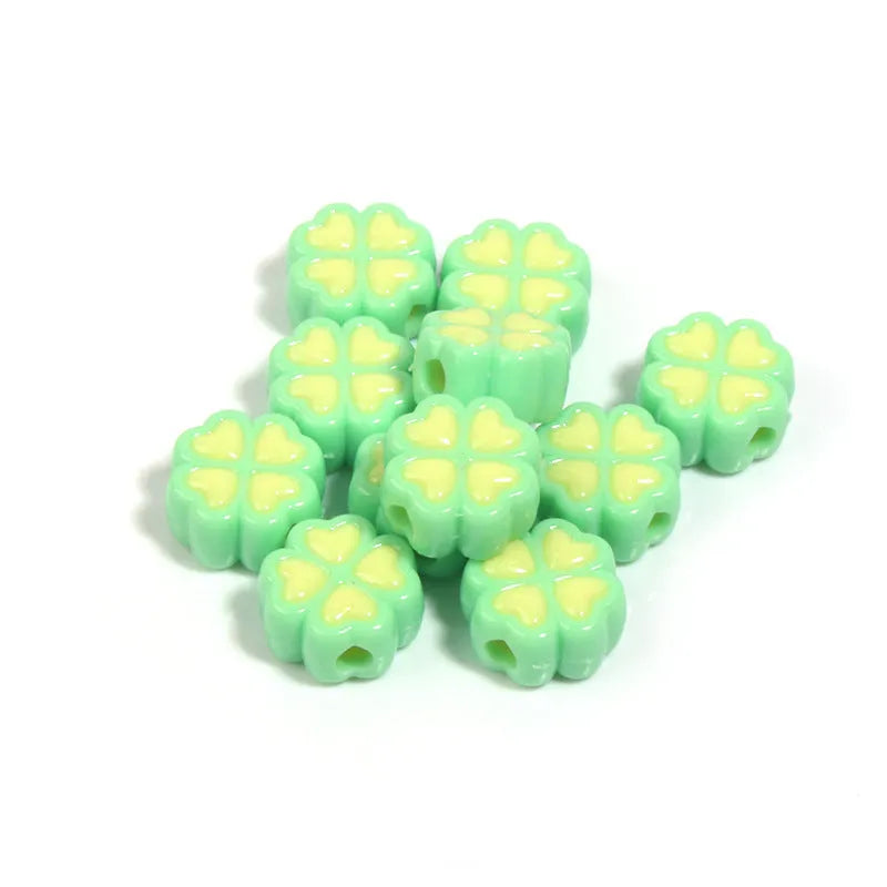 Assorted light-coloured acrylic clover-shaped beads with frosted finish, 15mm size.