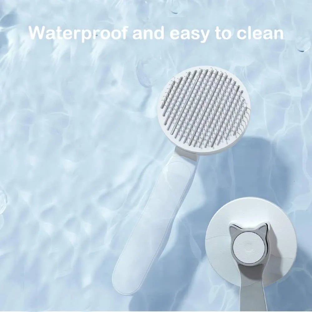 Blue self-cleaning cat and dog grooming brush with rubber handle on a white background.