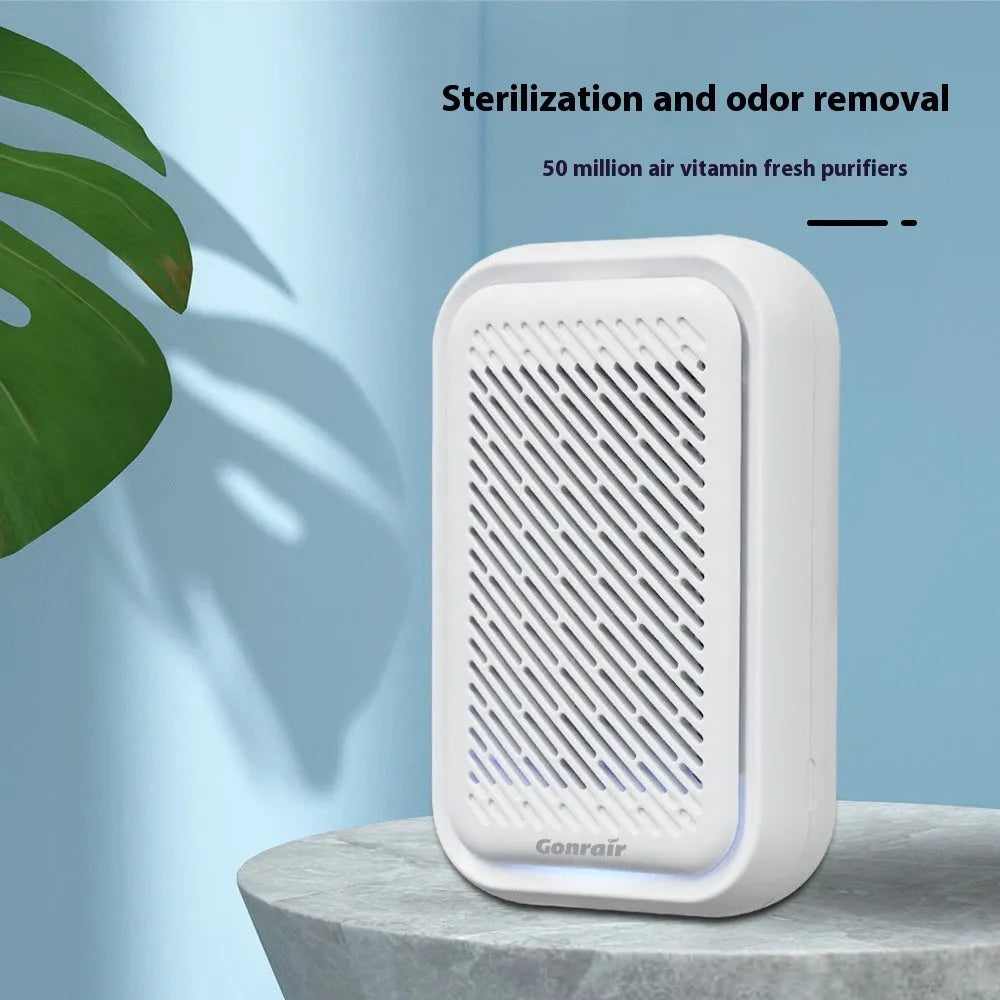 White wall-mounted plug-in air purifier unit for small rooms