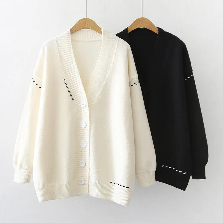 Women's long sleeve loose fit knitted cardigan coat in solid black or white colour.