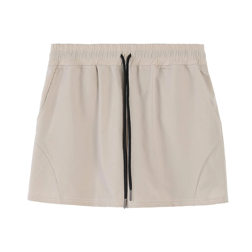 Men's thin grey polyester basketball shorts with an elastic waistband laid flat