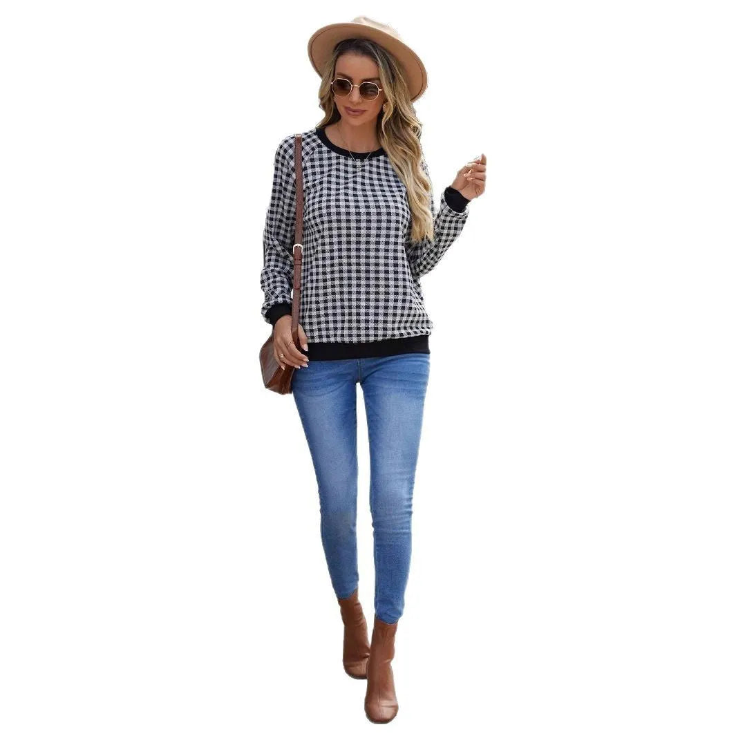 Black long sleeve pullover sweater with a Japanese sweet plaid and stripe pattern on a mannequin.