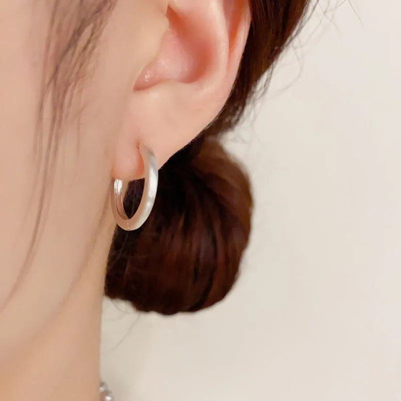 Geometric circle ear clip in gold finish with real gold plating on copper material