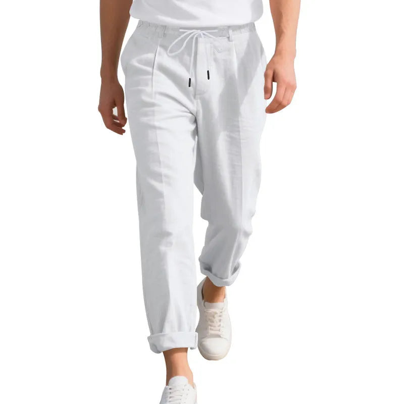 Men's light khaki linen casual trousers with drawstring waist and straight loose leg on hanger.