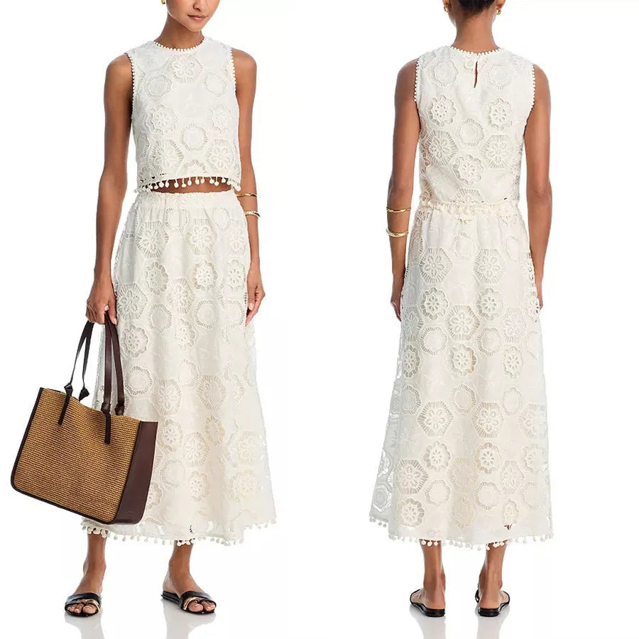 White women's sleeveless top and long skirt suit with embroidery detail