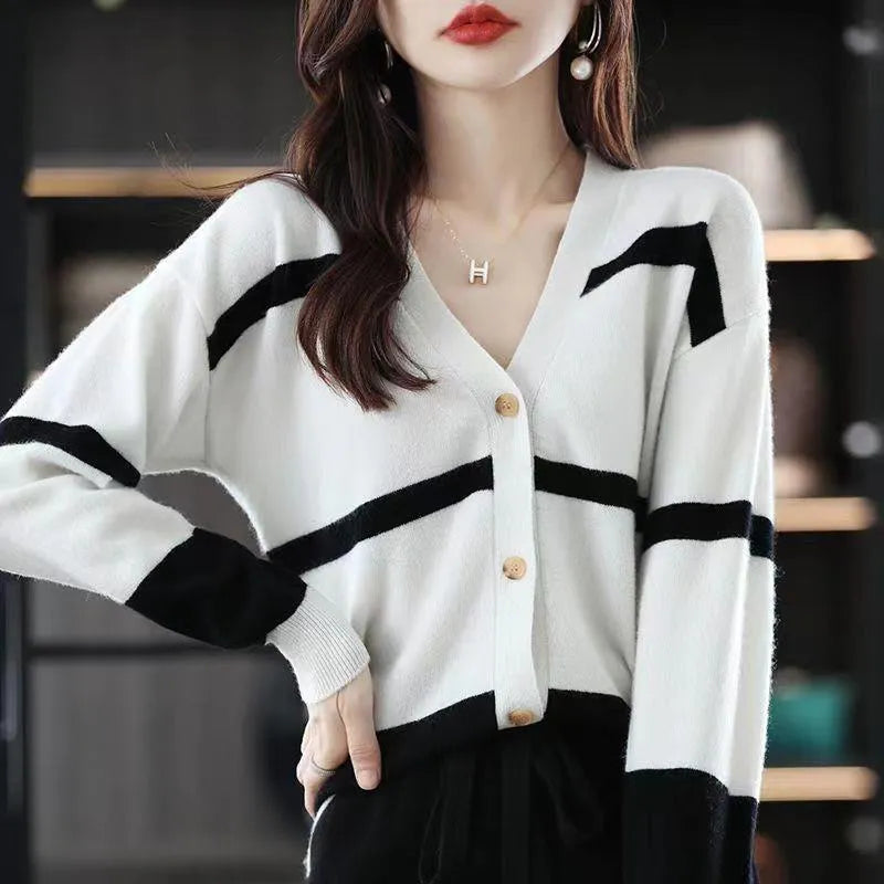 Women's slim fit striped cardigan with 3D pattern texture, V-neck, and button front closure.