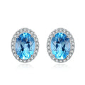 925 sterling silver jewellery set with blue topaz gemstones showing geometric design earrings, ring, pendant, and necklace