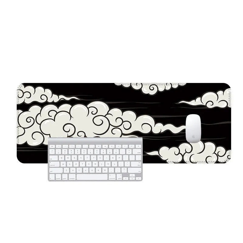 Large natural rubber desk mat with cloud pattern serving as mouse pad on office desk